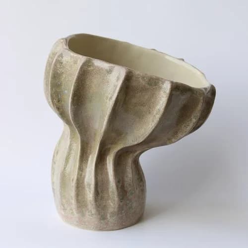 A pale fluted stoneware vase